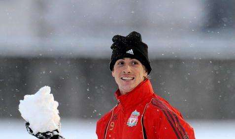 Torres gives up the football for a snowball