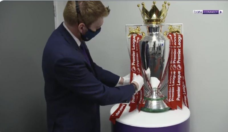 First (Image) of Premier League trophy in Liverpool red ribbons…