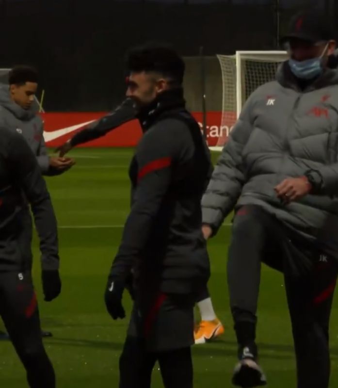 (Video) Klopp kicks Oxlade-Chamberlain up the backside in cheeky training ground moment