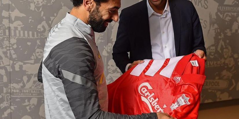 (Image) Mo Salah presented with the 1992 Liverpool home shirt as part of his PFA Player of the Month award