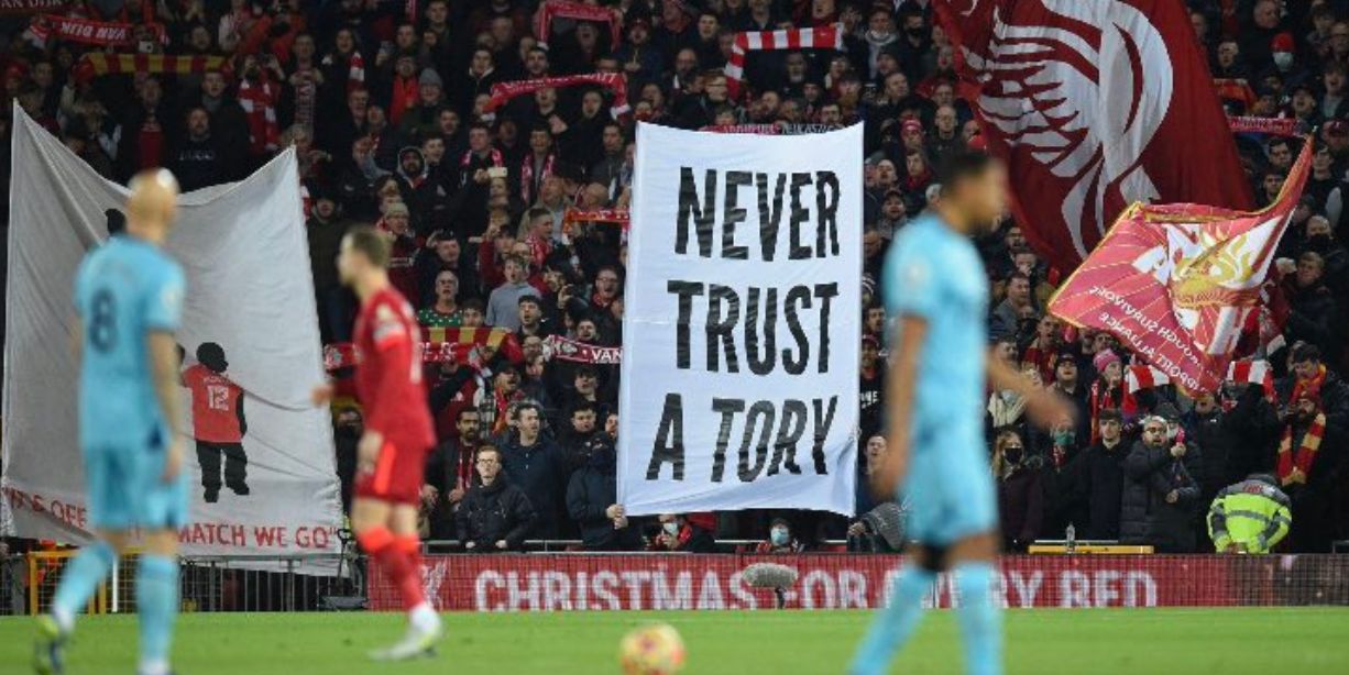 (Image) Liverpool fans unveil new ‘Never Trust a Tory’ banner on the Kop ahead of Newcastle United victory