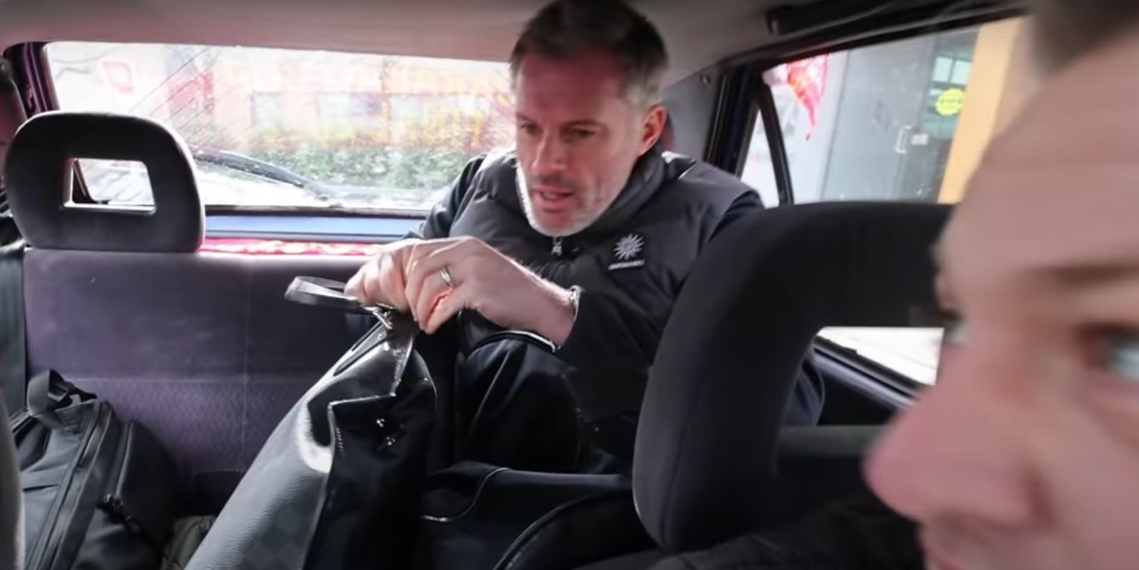 (Video) Jamie Carragher joins two Liverpool fans in their £40 car, driving from Melwood to Wembley