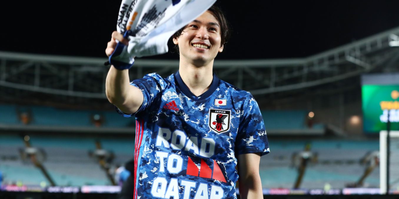 Takumi Minamino celebrates Japan reaching the 2022 World Cup in Qatar