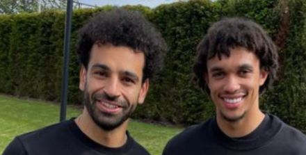 (image) Mo Salah and Trent Alexander-Arnold pose with assist trophy as the pair record 25 assists together