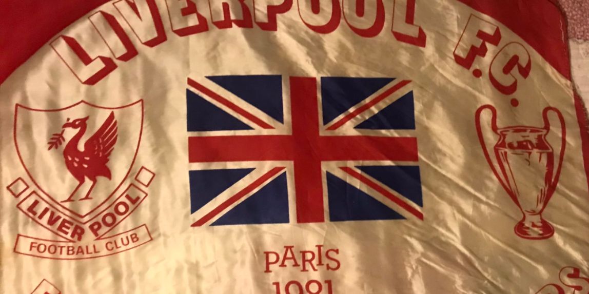 (Image) Liverpool fan takes 40-year-old Paris flag back to France for another Champions League final against Real Madrid
