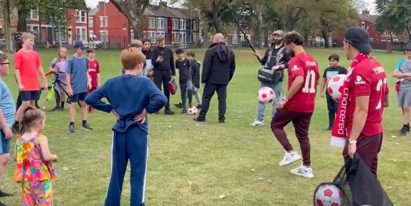 (Video) Mo Salah joined by Kostas Tsimikas as the Egyptian King plays two-touch with a group of kids in Anfield