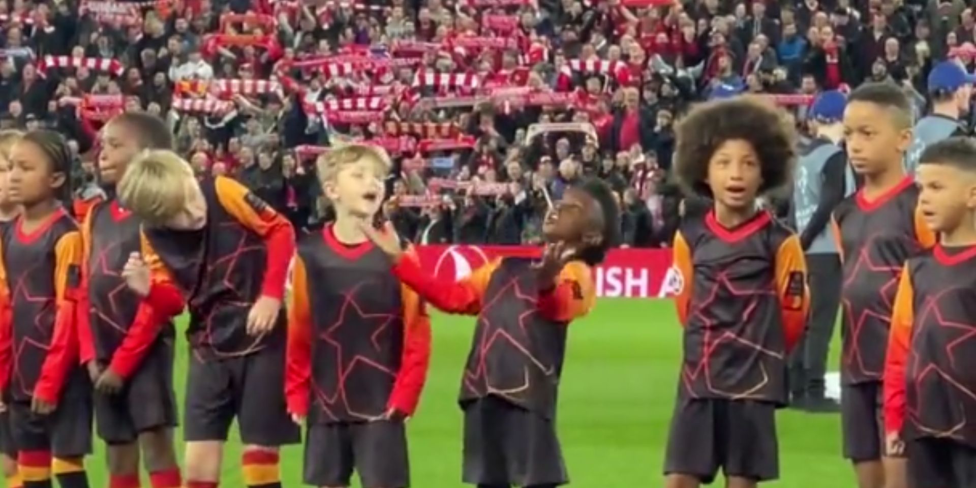 (Video) Adorable moment young UEFA mascots join in with Anfield crowd singing ‘You’ll Never Walk Alone’