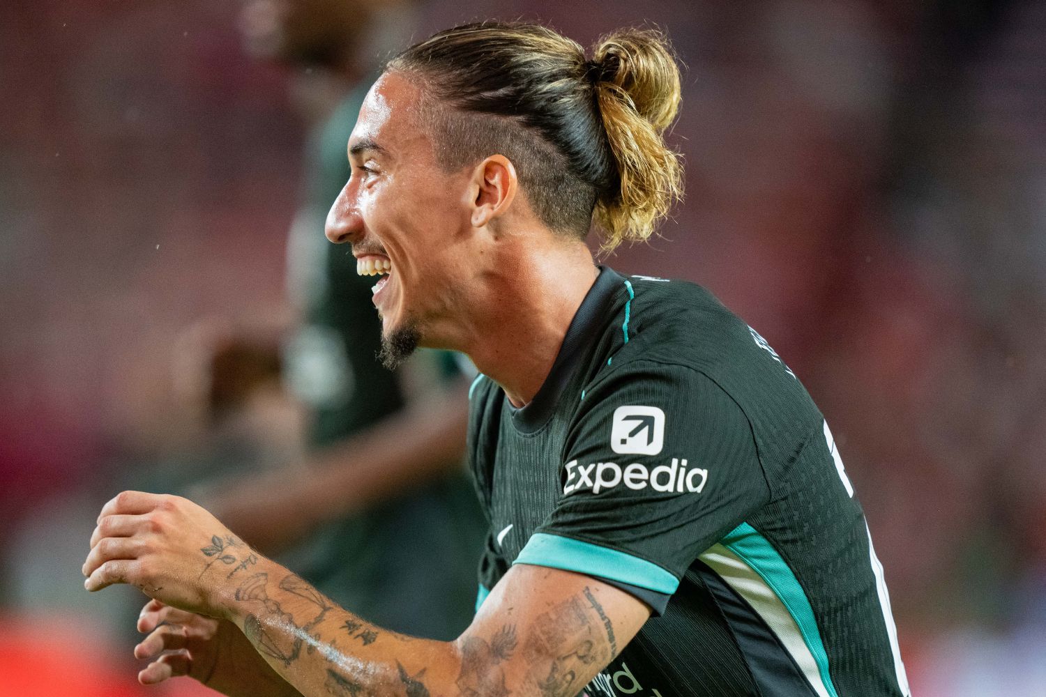 Kostas Tsimikas laughs during Liverpool pre-season game