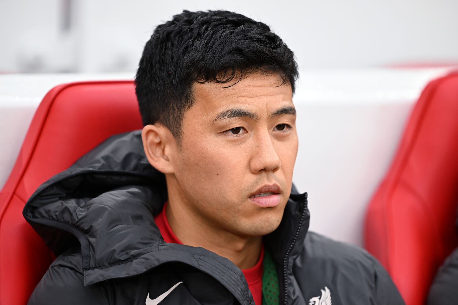 Wataru Endo sits on the bench for Liverpool