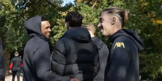 Kostas Tsimikas and Trent Alexander-Arnold laugh