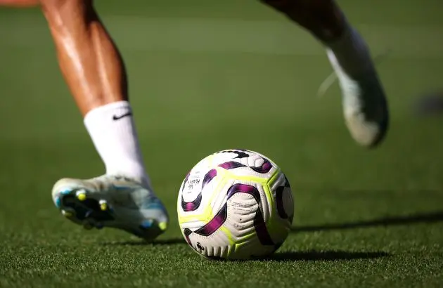 A Liverpool player strikes the ball during a pre-match warm-up