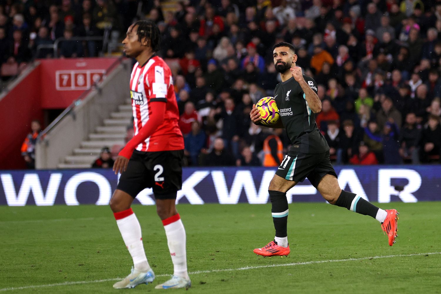 Mo Salah celebrates scoring his first goal vs. Southampton