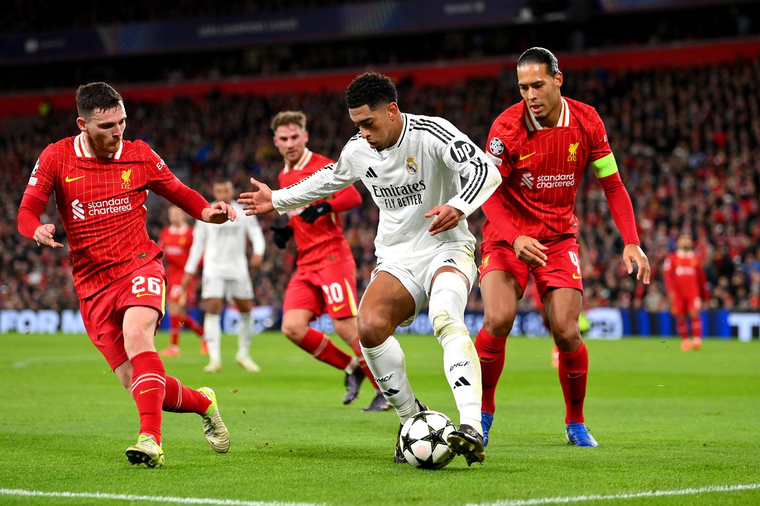 Virgil van Dijk battles with Jude Belingham