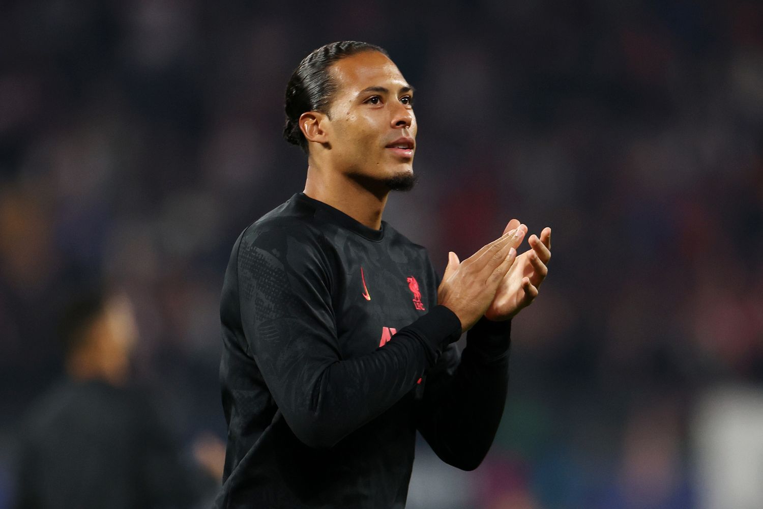 Virgil van Dijk warms up for Liverpool in the Champions League