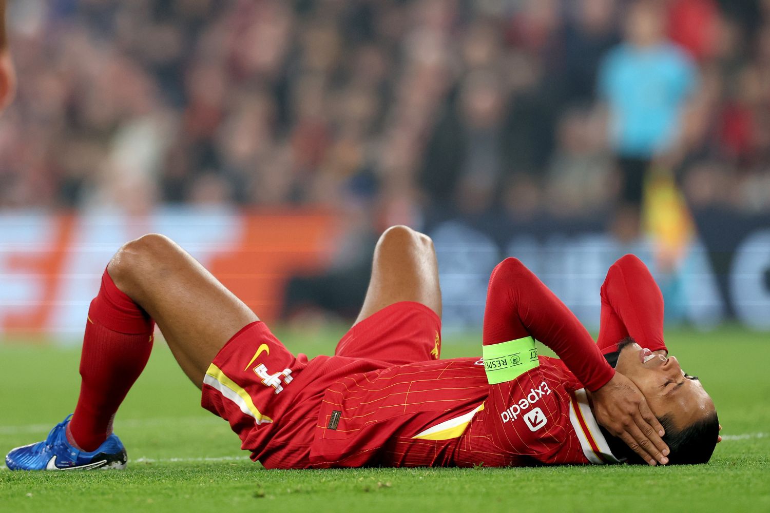 Virgil van Dijk lays injured on the floor for Liverpool