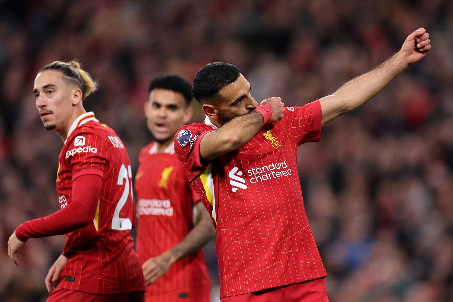 Mo Salah celebrates scoring against Brighton