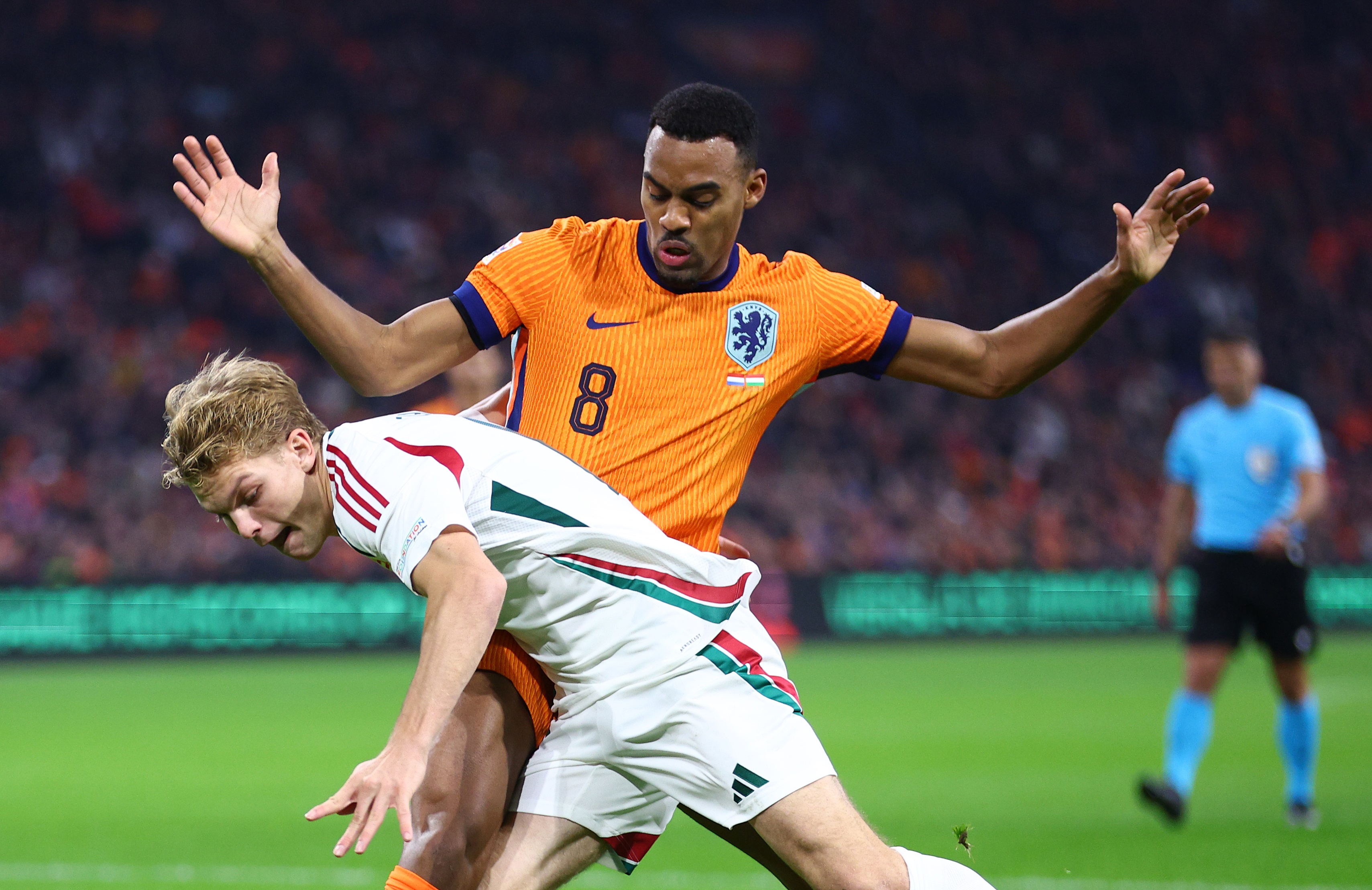 Liverpool midfielder Ryan Gravenberch competes for the ball with the Netherlands national team.