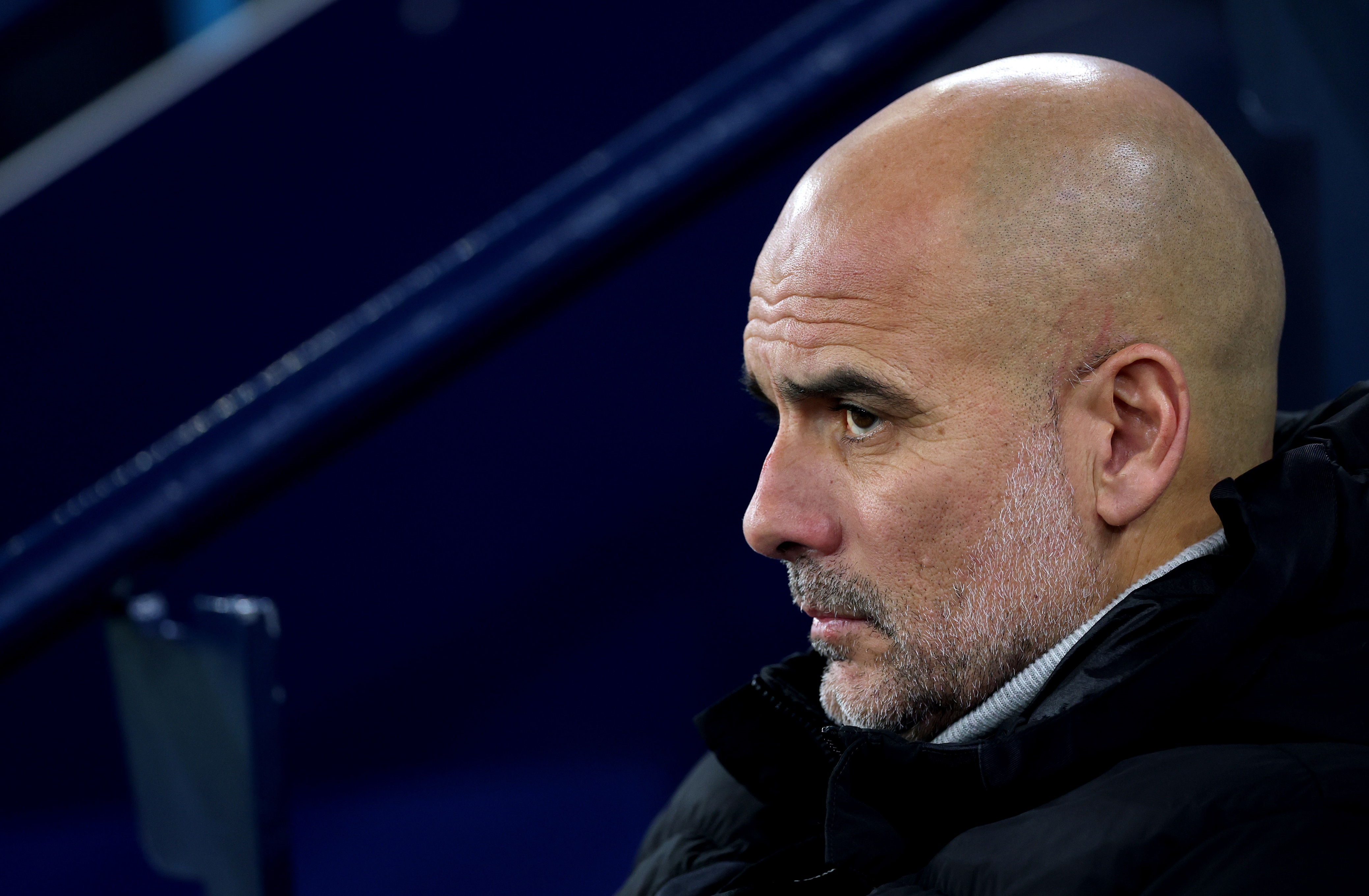 Pep Guardiola observes Man City v Feyenoord in the Champions League.