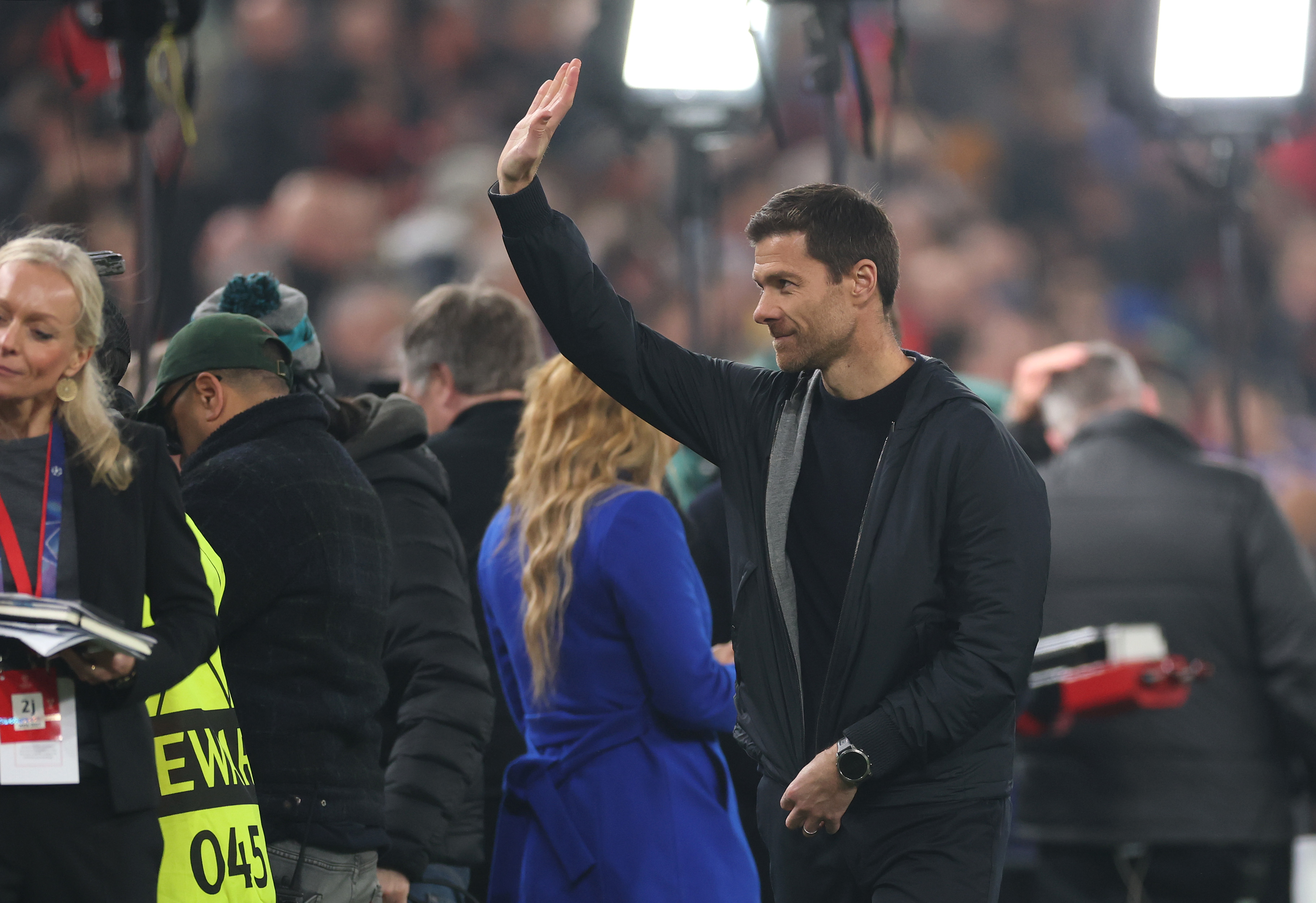 Xabi Alonso waves to Liverpool fans before Bayer Leverkusen's match at Anfield