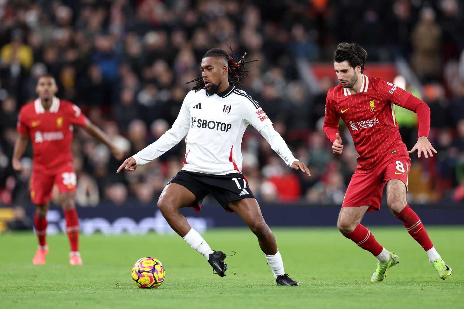 Alex Iwobi in action against Liverpool