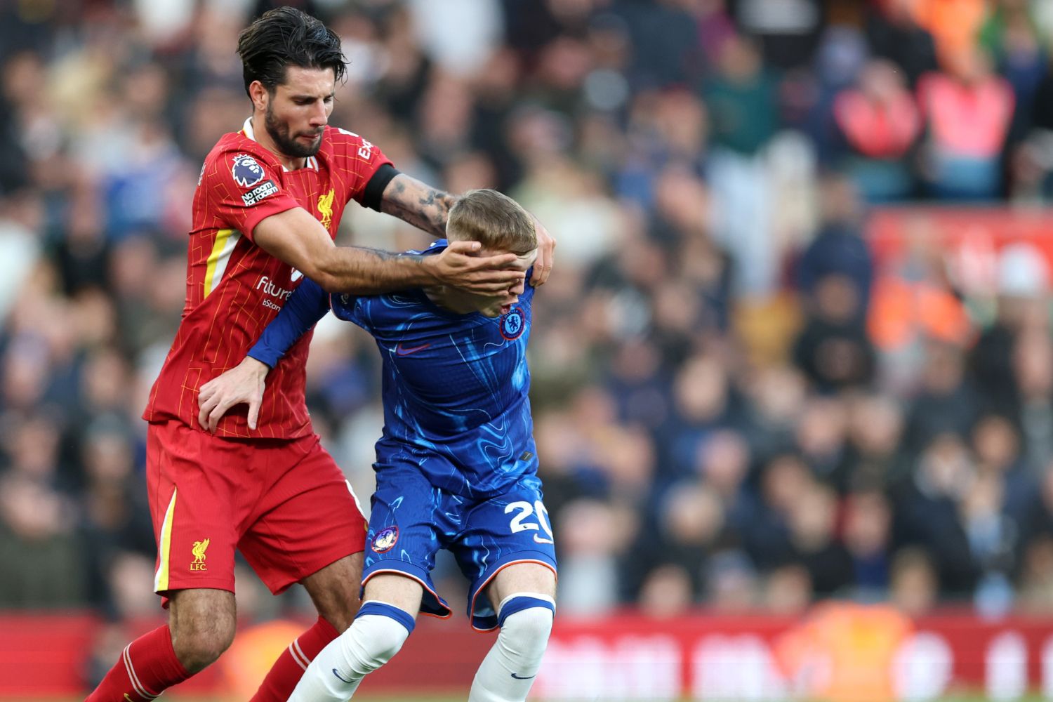 Cole Palmer struggles to keep the ball against Dominik Szoboszlai