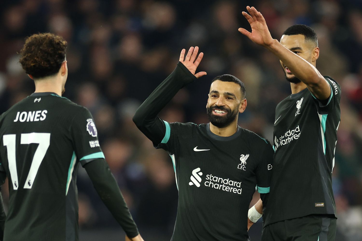 Salah and Gakpo celebrate during the match against West Ham.