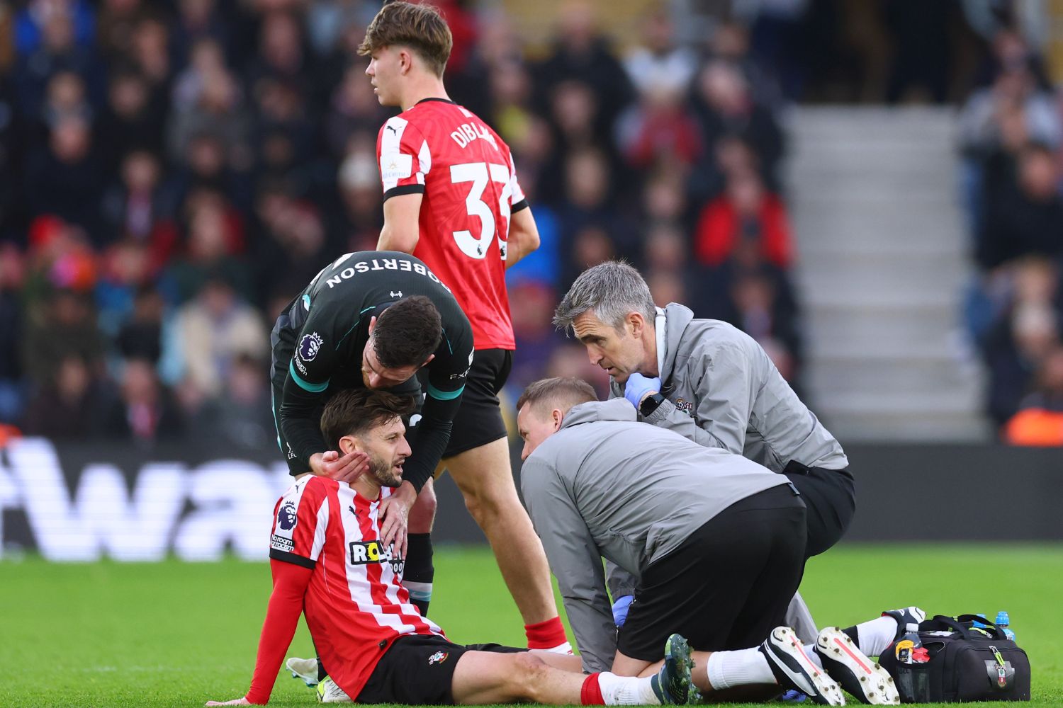 Adam Lallana lays injured for Southampton against Liverpool