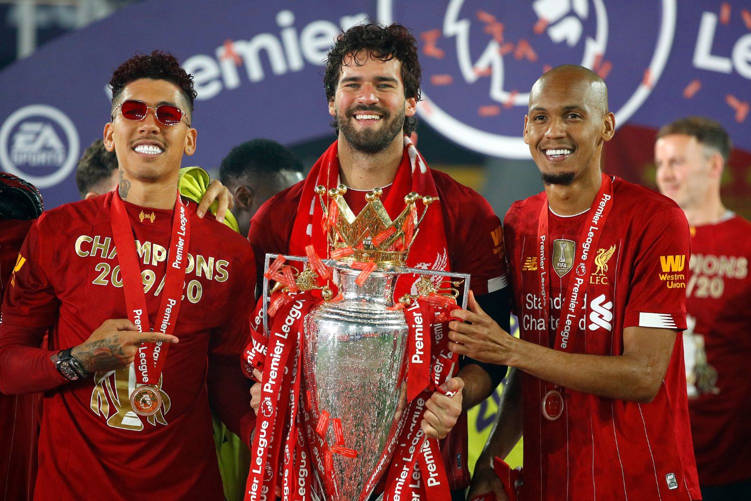 Alisson with the Premier League trophy