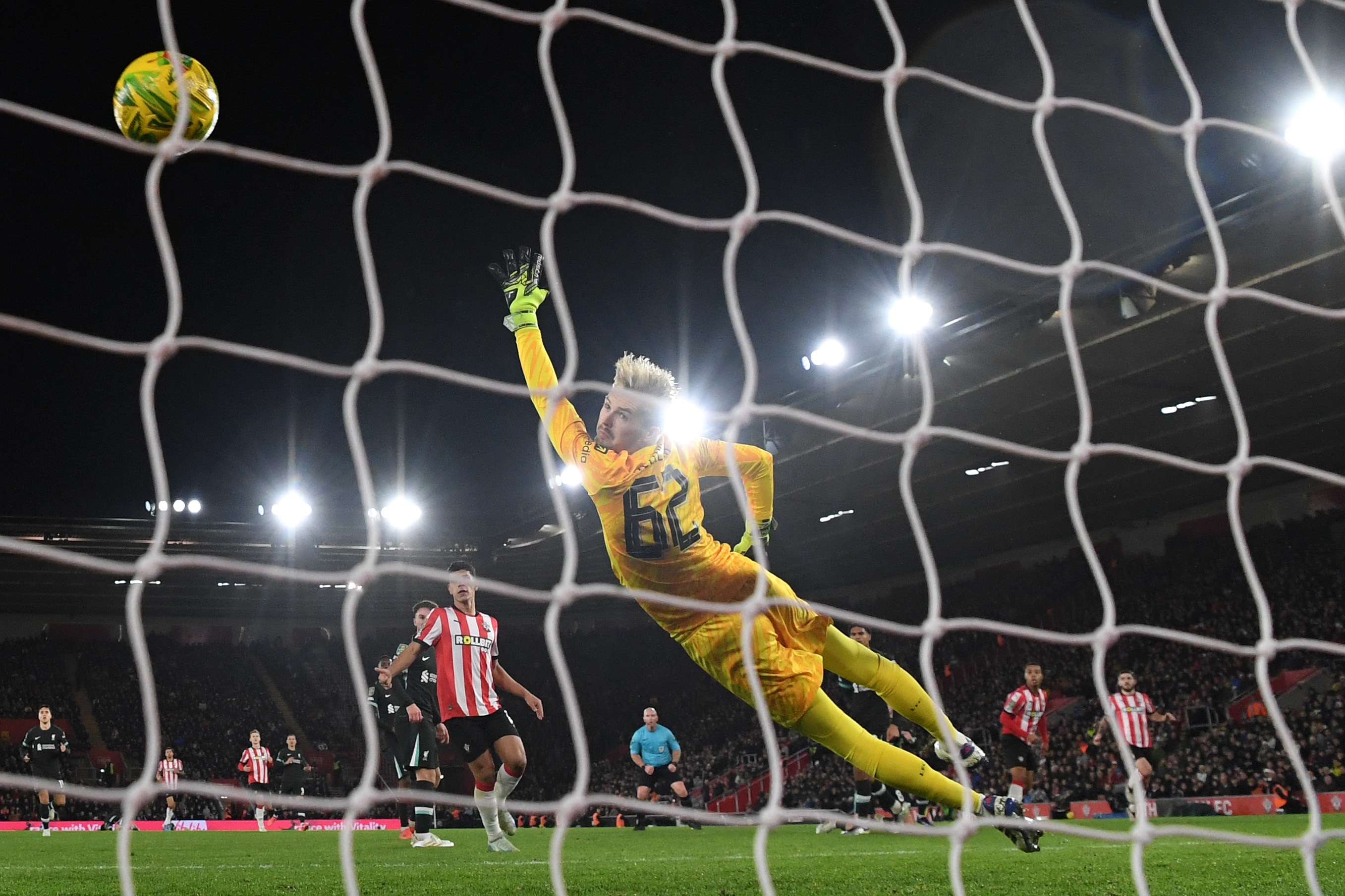 Caoimhin Kelleher leaps to try and save a shot from Southampton during the League Cup win.