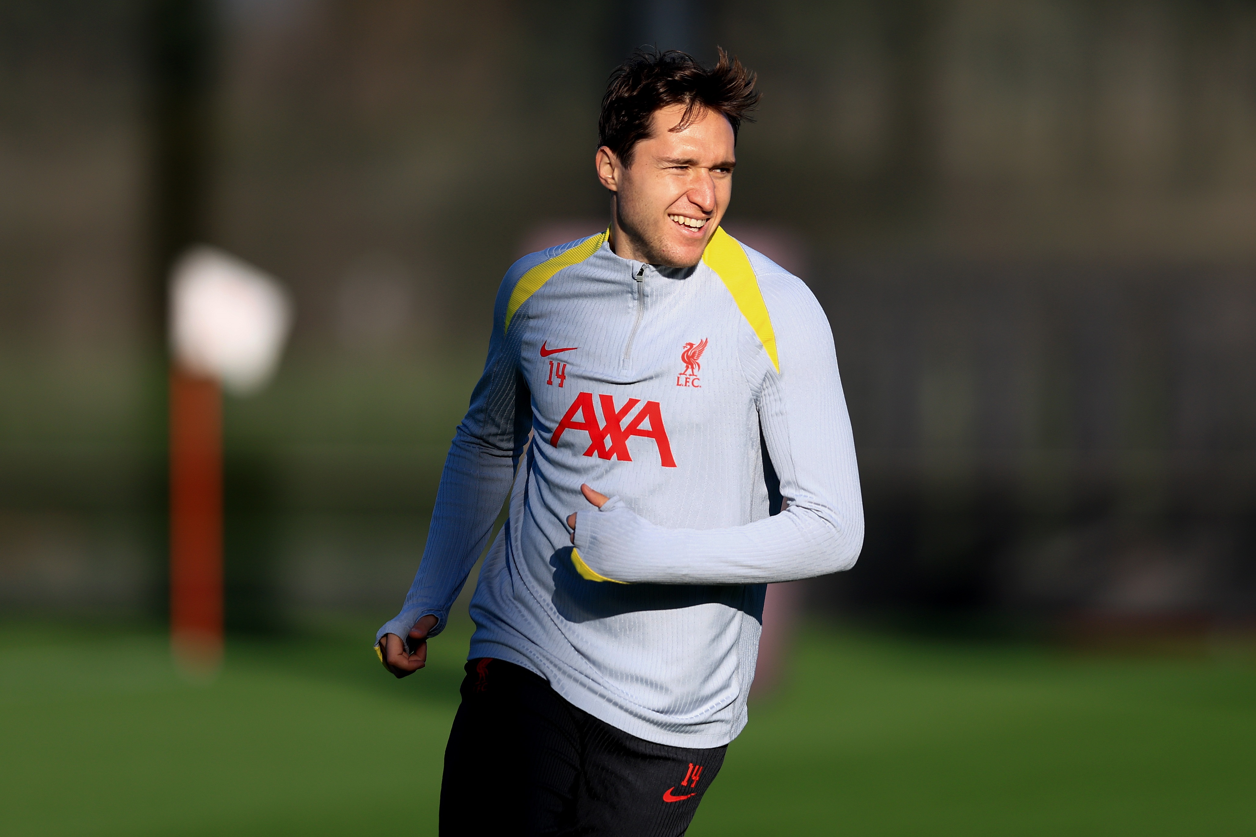 Federico Chiesa runs in training at Liverpool's AXA centre.