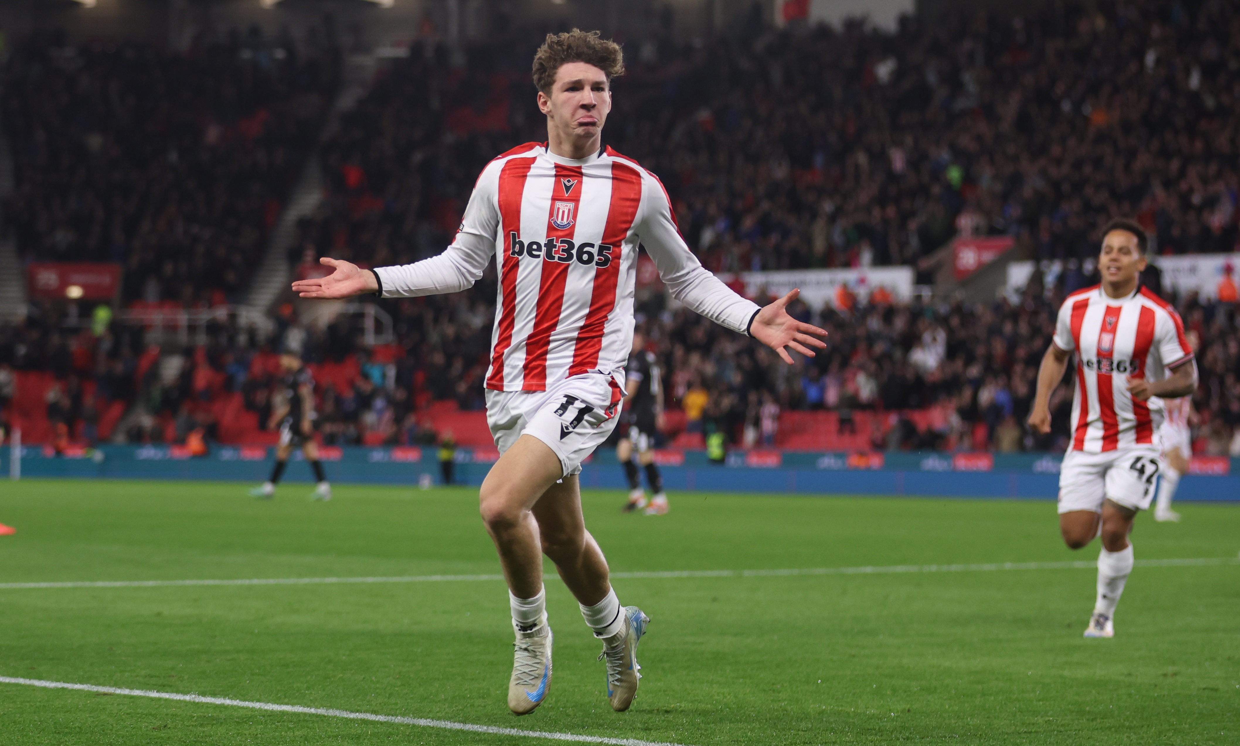 Lewis Koumas celebrates scoring a goal for Stoke City.