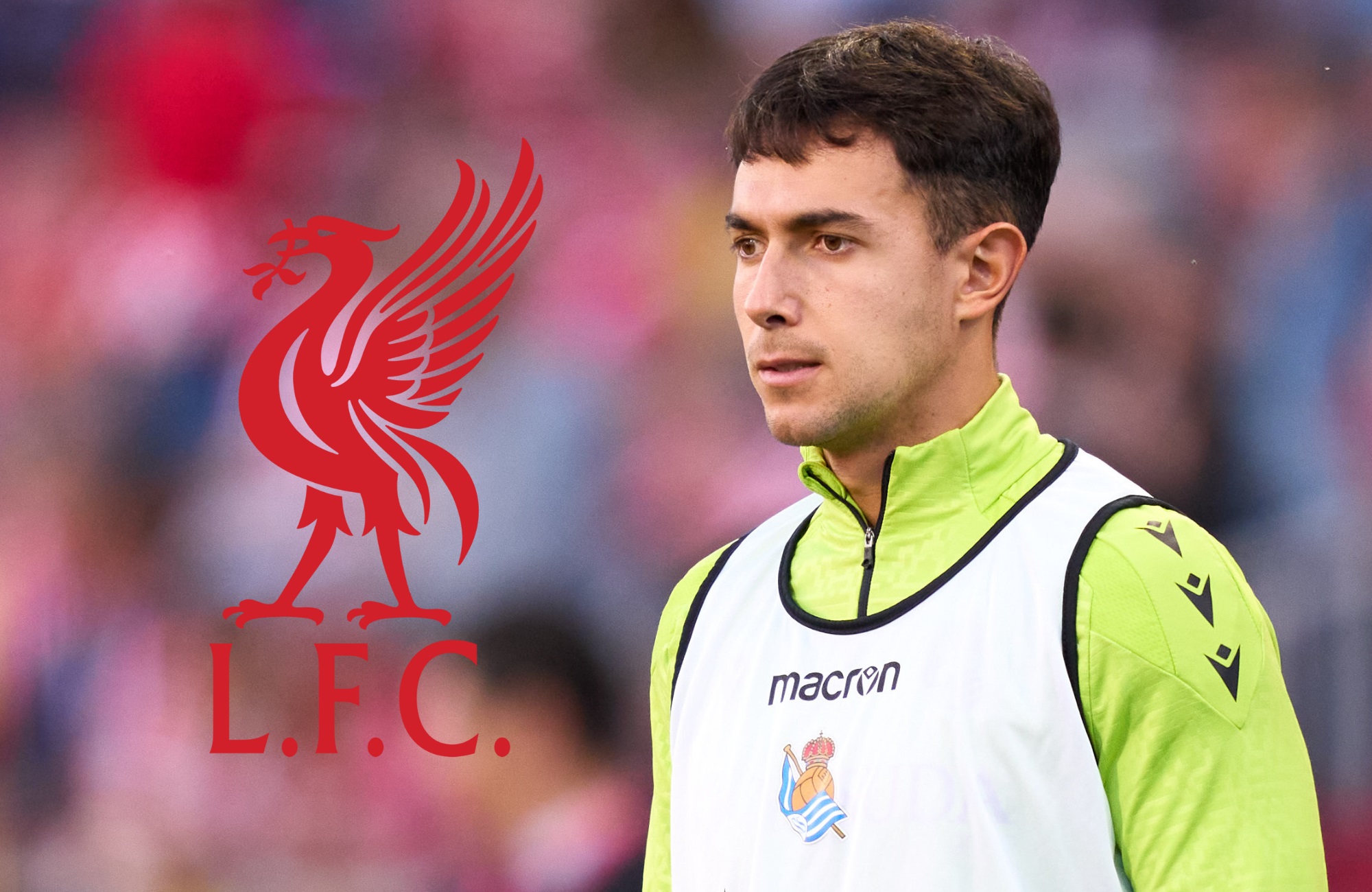 Martin Zubimendi looks on at the Liverpool club crest.