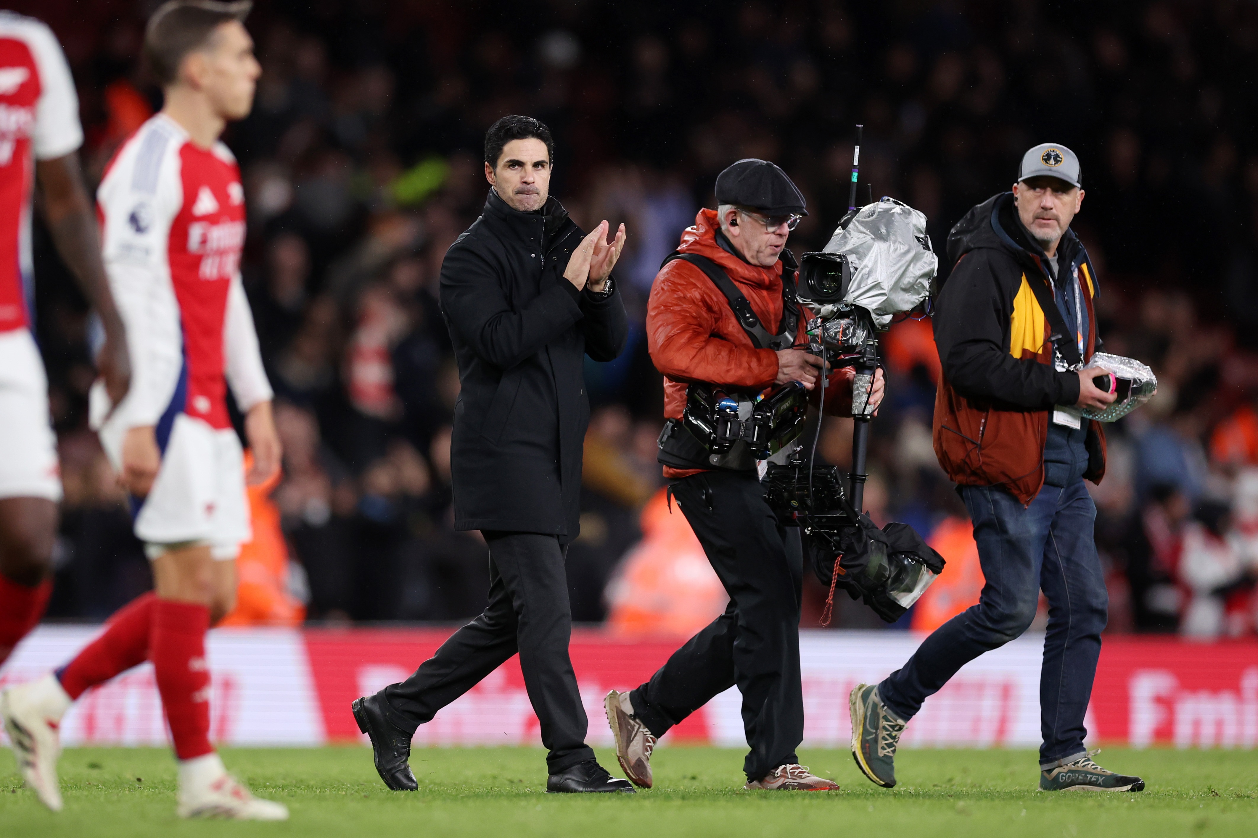 Mikel Arteta applauds fans at the Emirates Stadium.