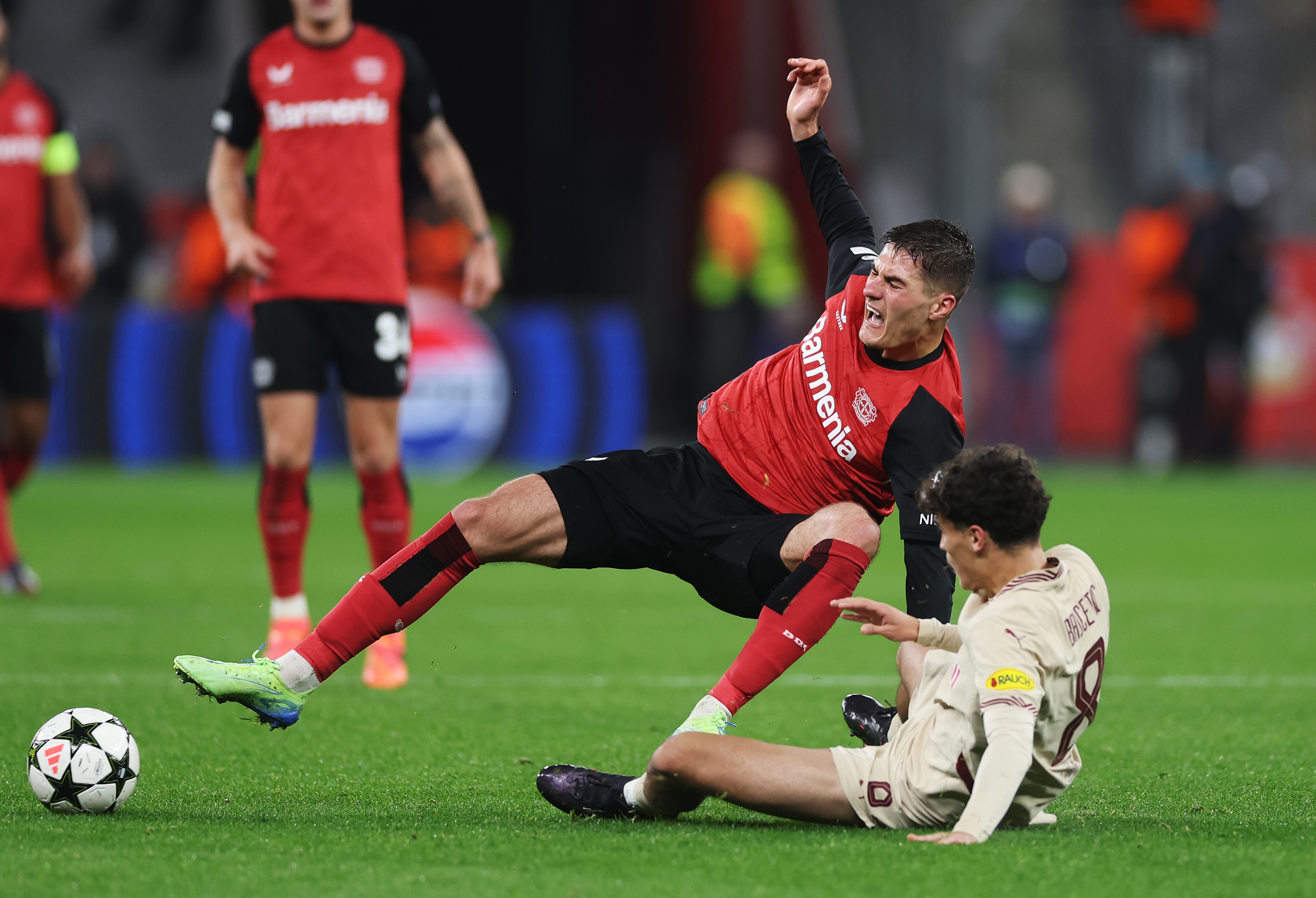 Stefan Bajcetic tackles Bayer Leverkusen forward Patrik Schick at the BayArena.