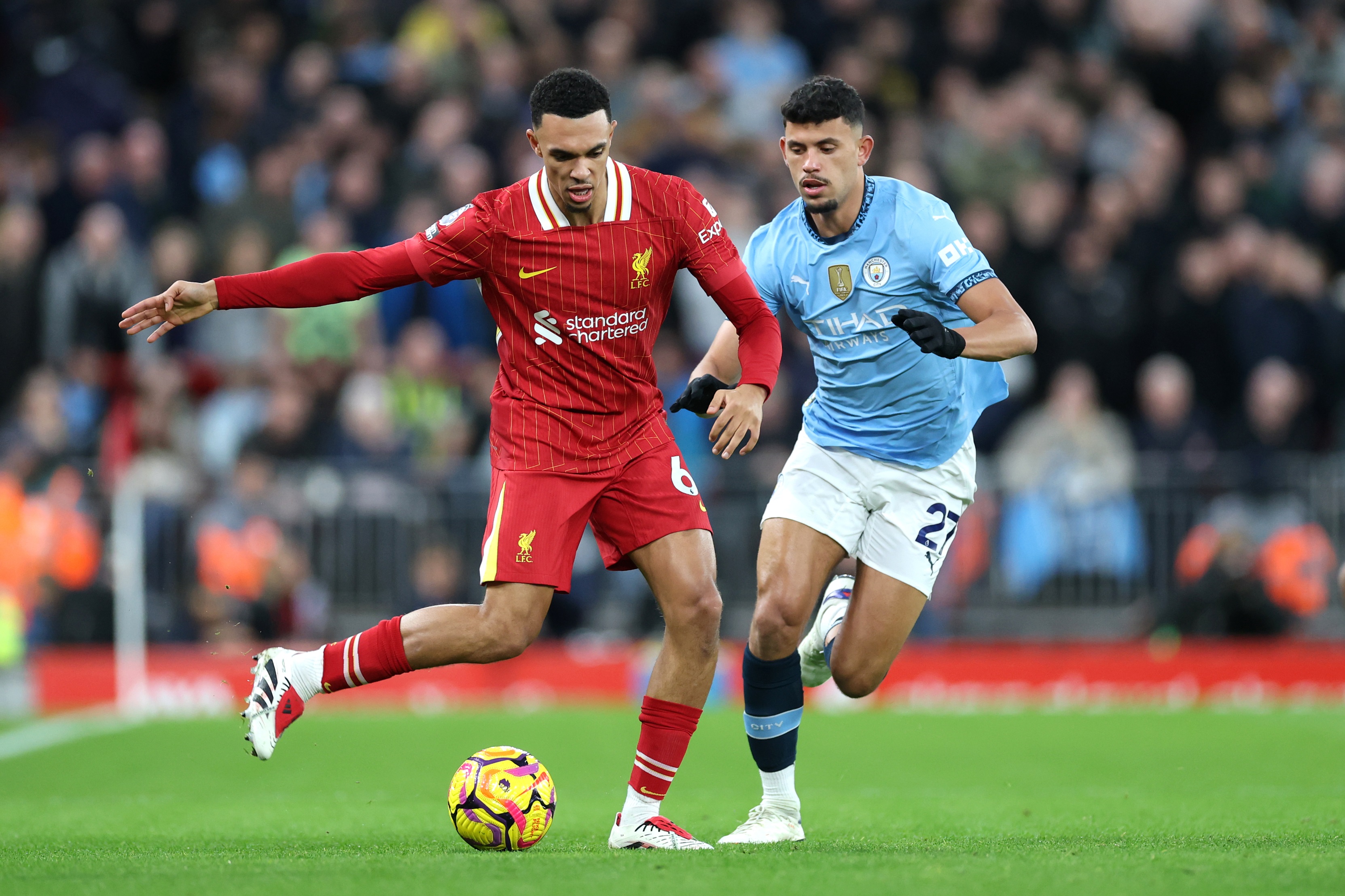 Trent Alexander-Arnold competes against Manchester City in the Premier League.