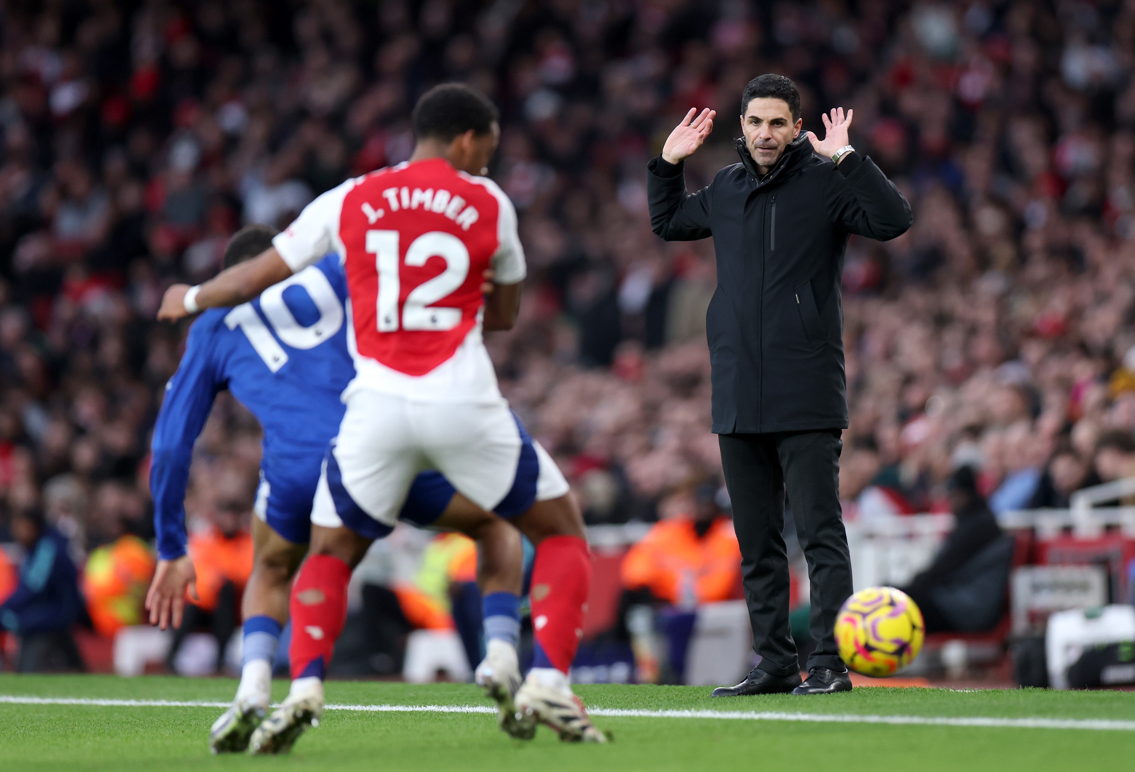 Mikel Arteta holds up his hands during Arsenal v Everton.