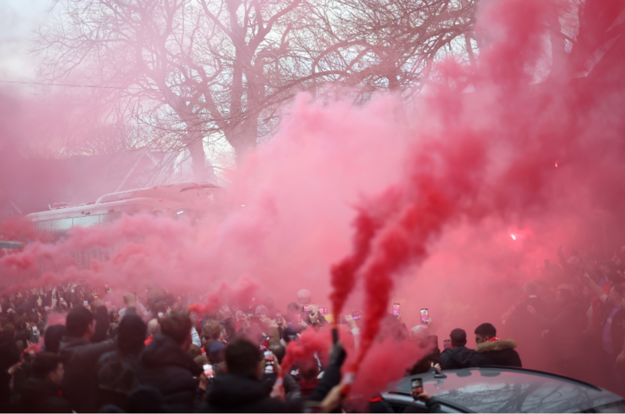 Liverpool fans greet the team bus ahead of the clash against Man City