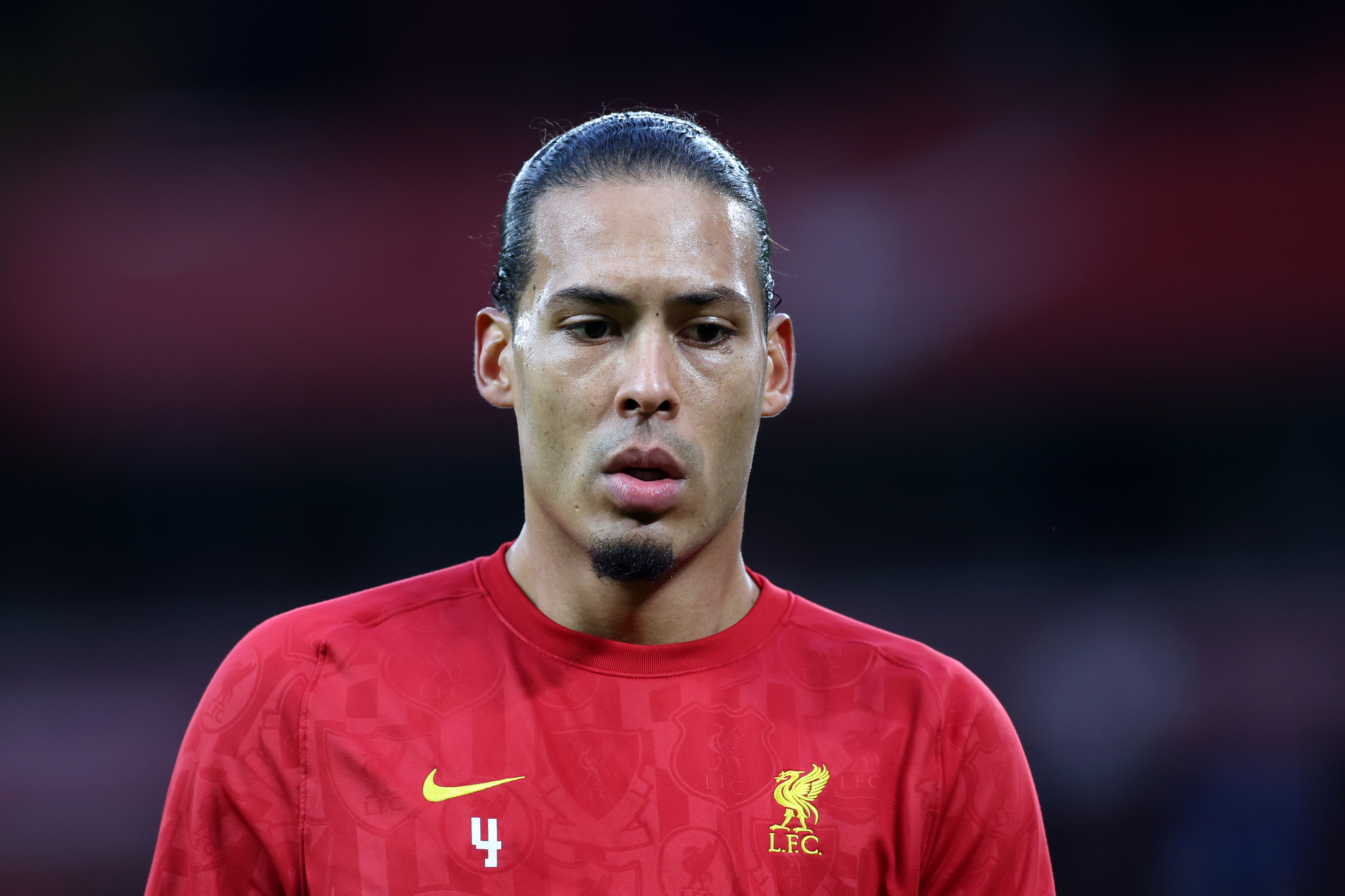 Virgil van Dijk warms up ahead of Fulham clash.