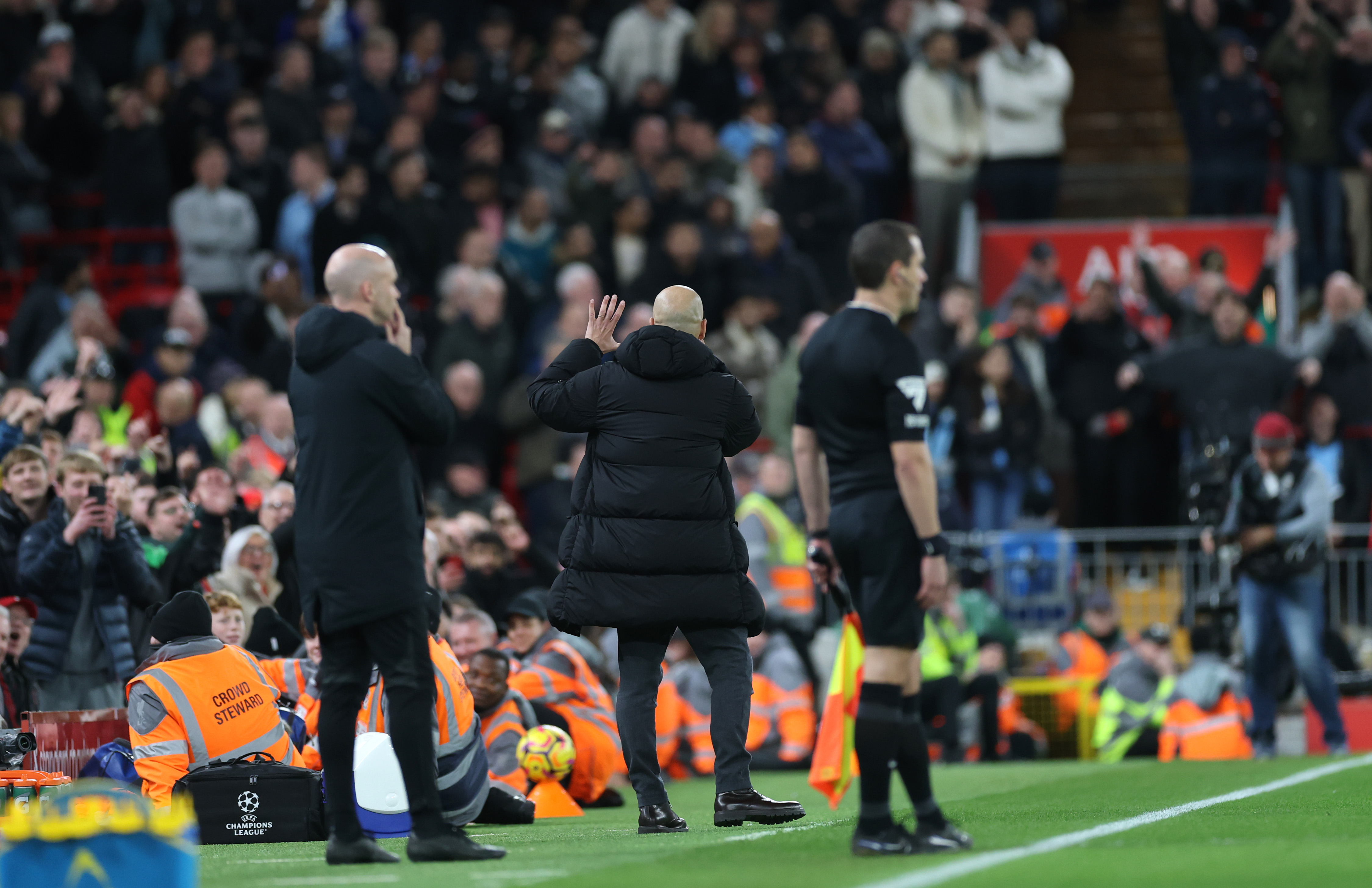 Pep Guardiola gestures to Liverpool fans during Man City loss.