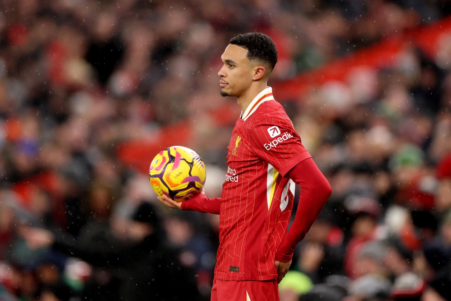 Trent Alexander-Arnold takes a throw-in against Manchester United