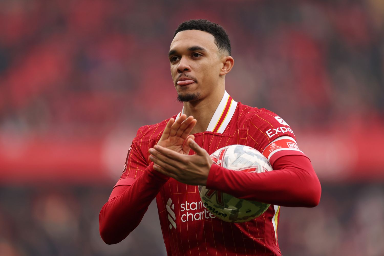 Trent Alexander-Arnold applauds Liverpool fans during game against Accrington Stanley