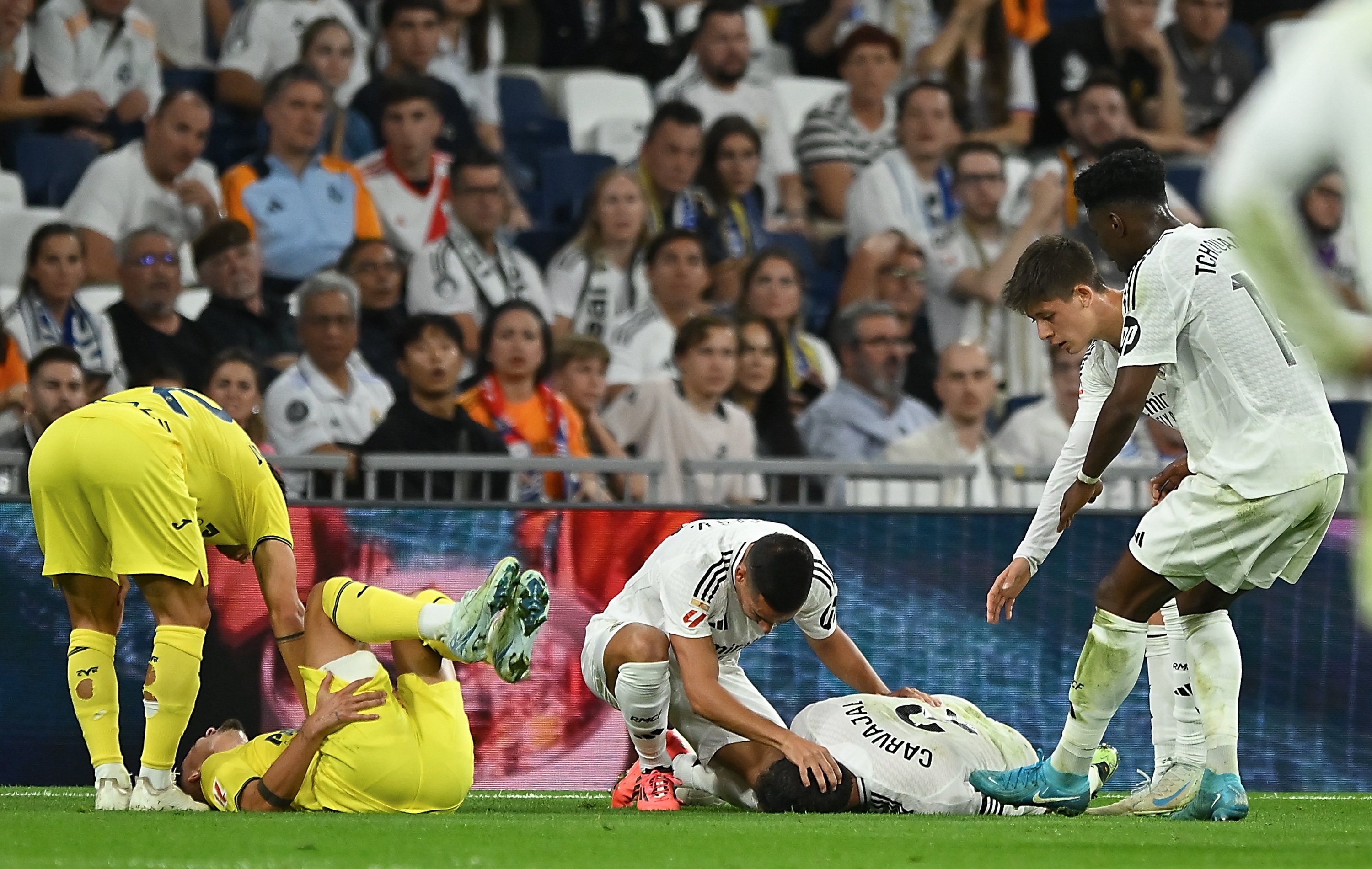 Dani Carvajal lies down injured after a collision with Yeremi Pino.