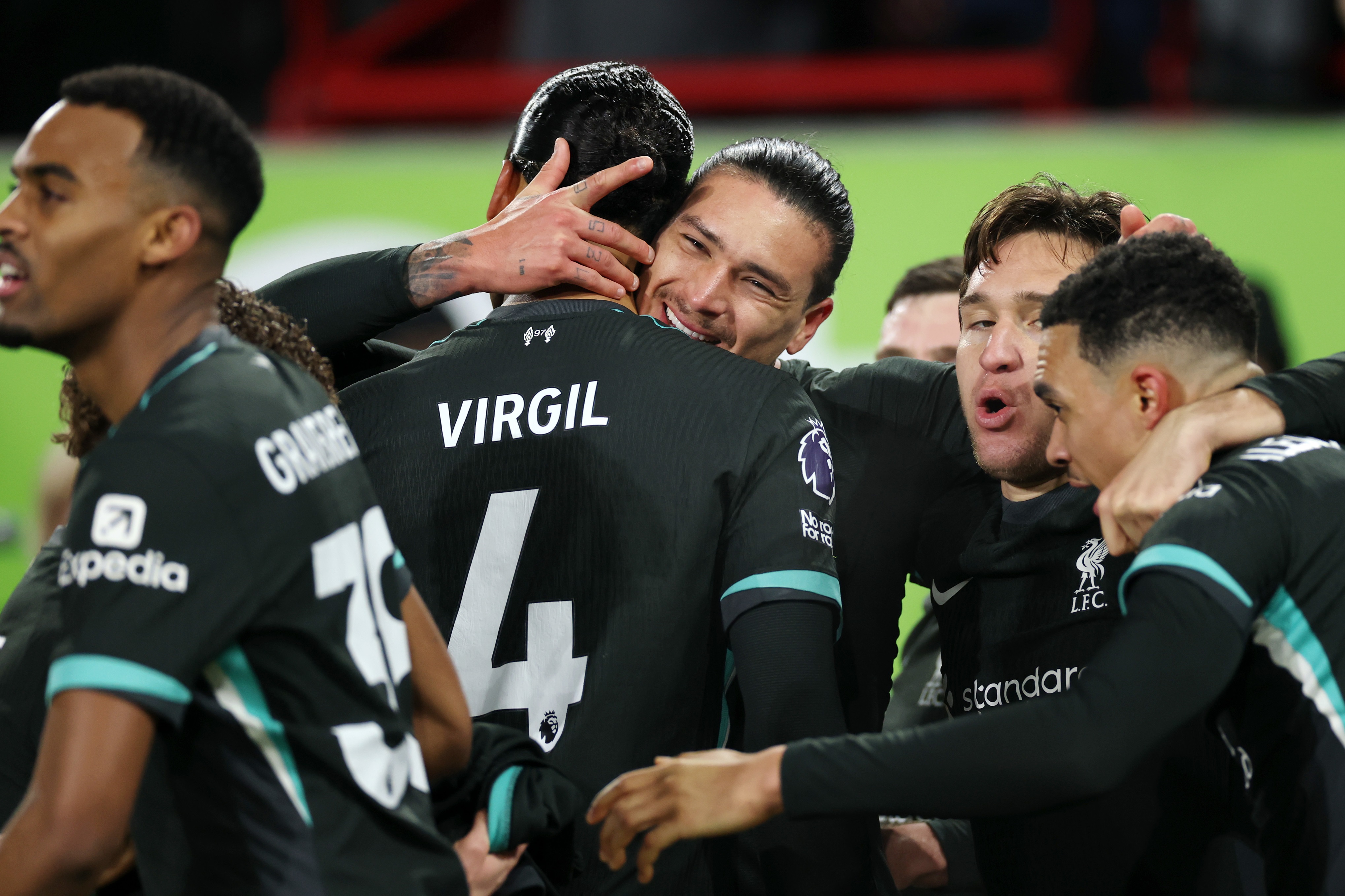 Federico Chiesa celebrates with Darwin Nunez and Liverpool players.