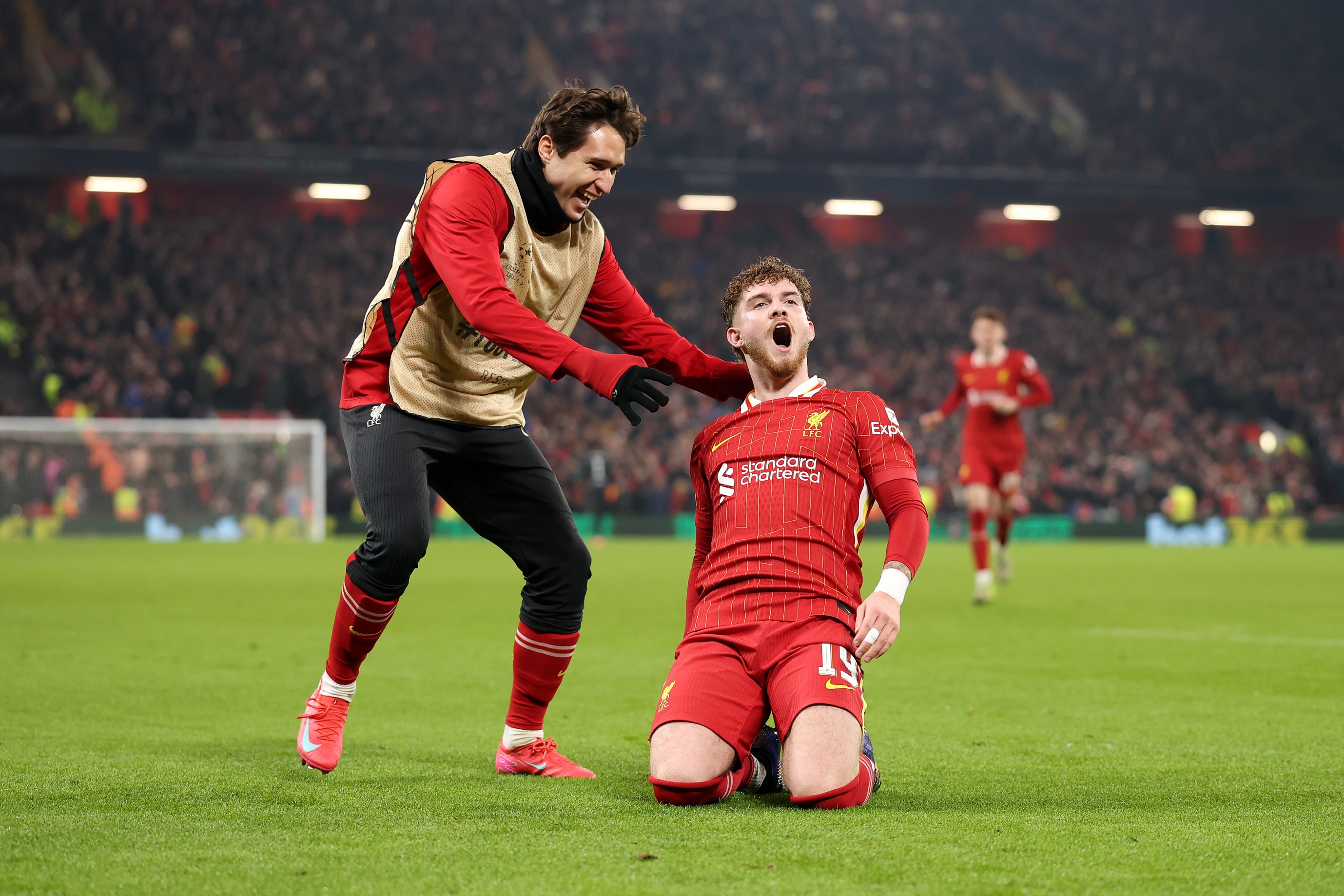 Liverpool substitute Federico Chiesa celebrates with Harvey Elliott after scoring.