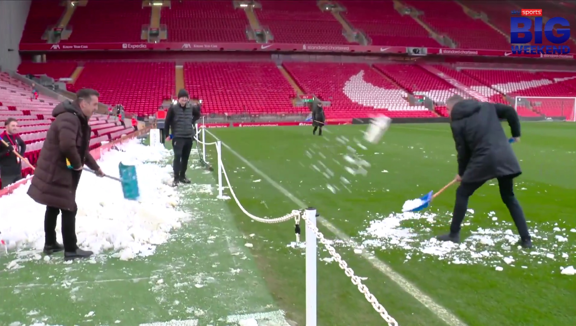 Jamie Carragher and Gary Neville shovel snow at each other at Anfield.