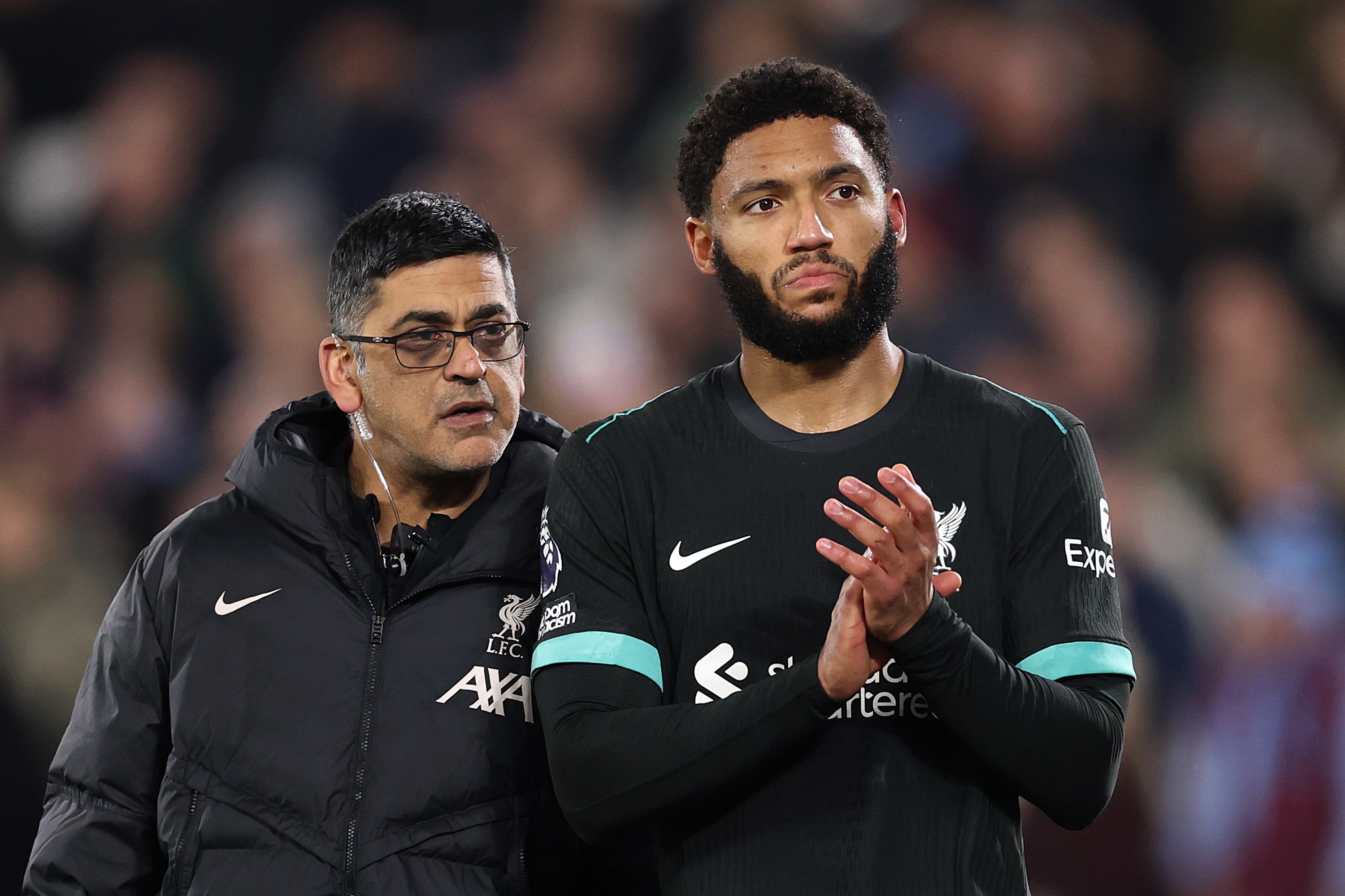 Joe Gomez claps Liverpool's away fans after going off injured against West Ham.