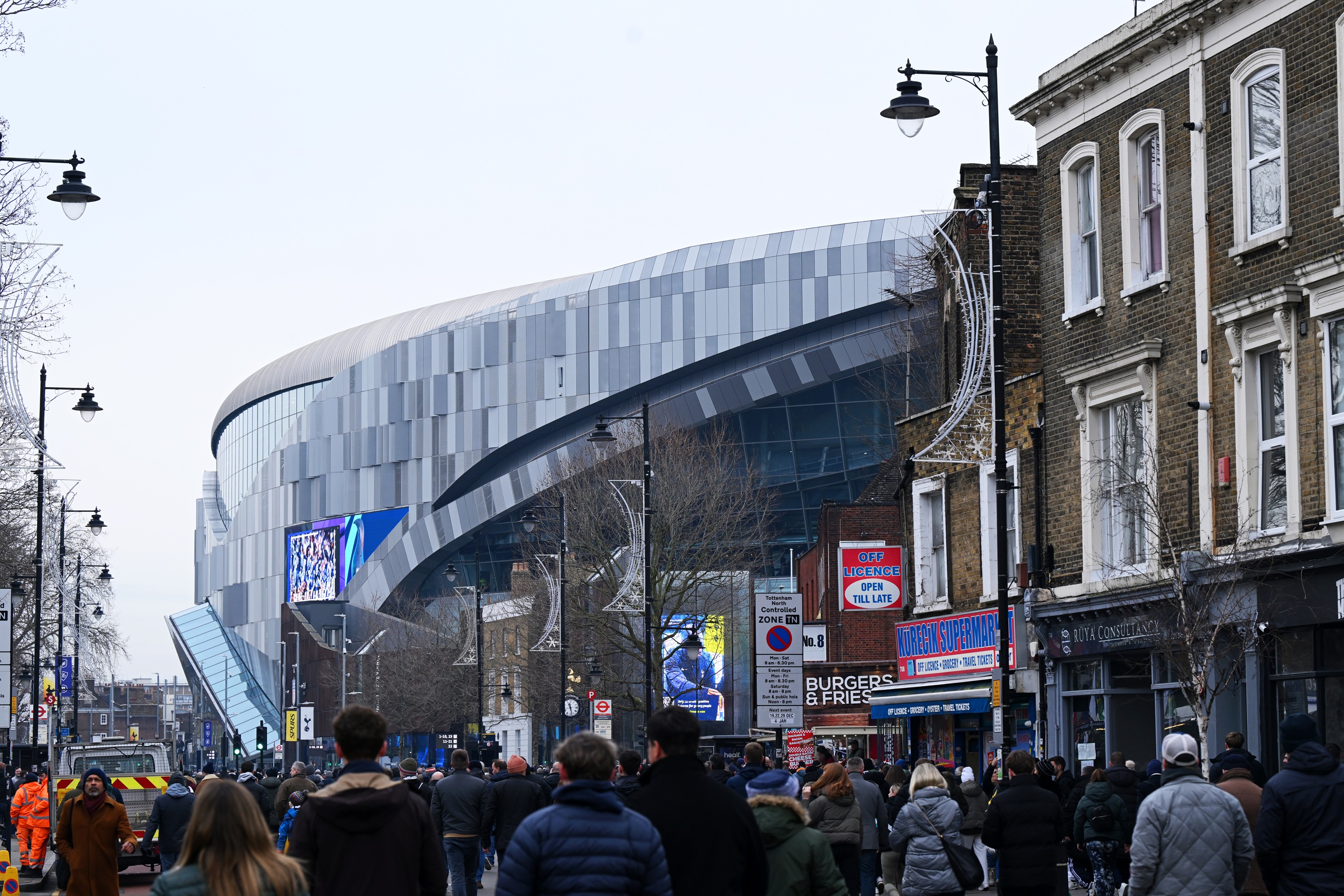 Fans walking to the Tottenham Hotspur Stadium.