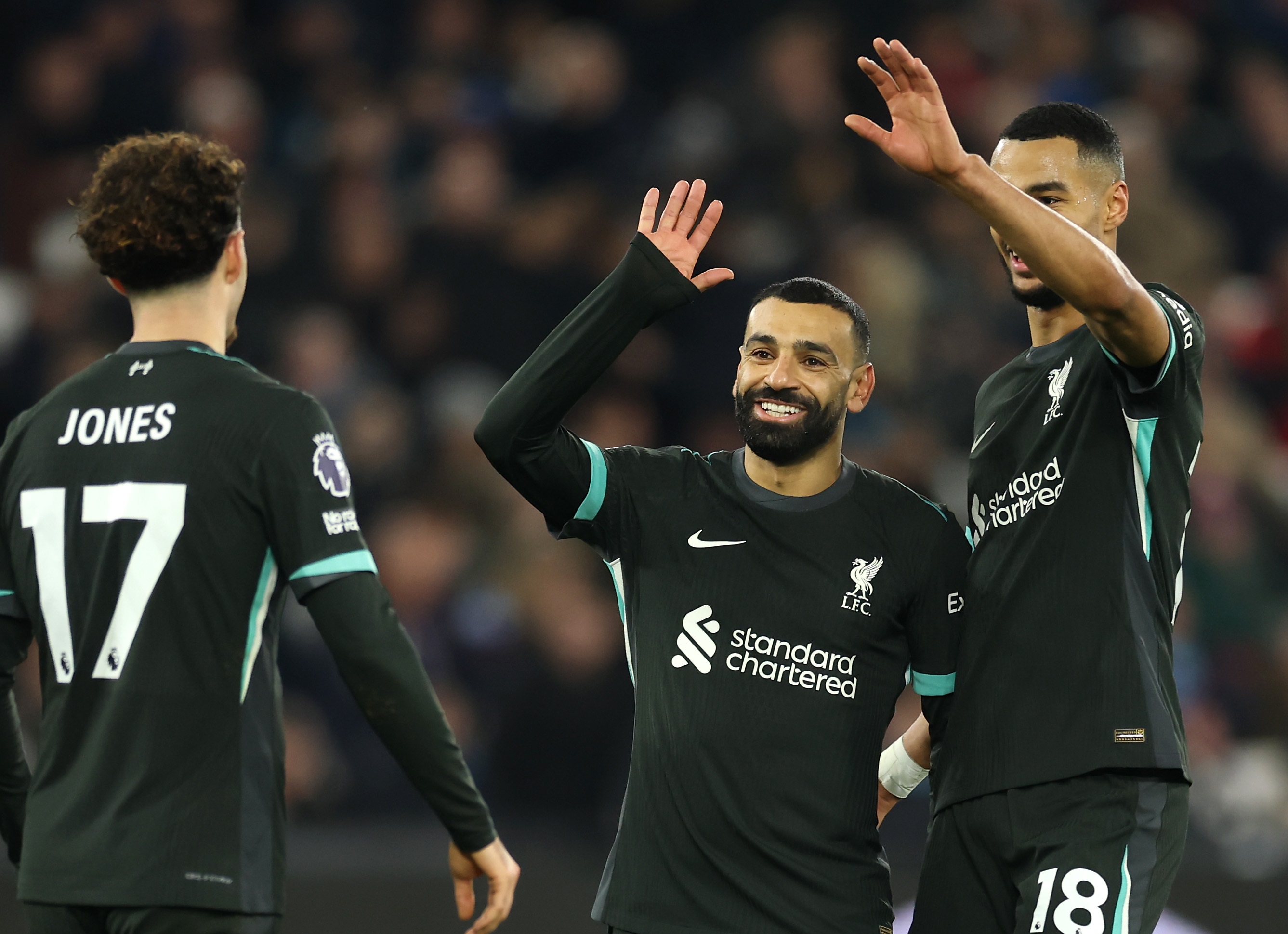 Mo Salah celebrates his goal against West Ham with Curtis Jones and Cody Gakpo.