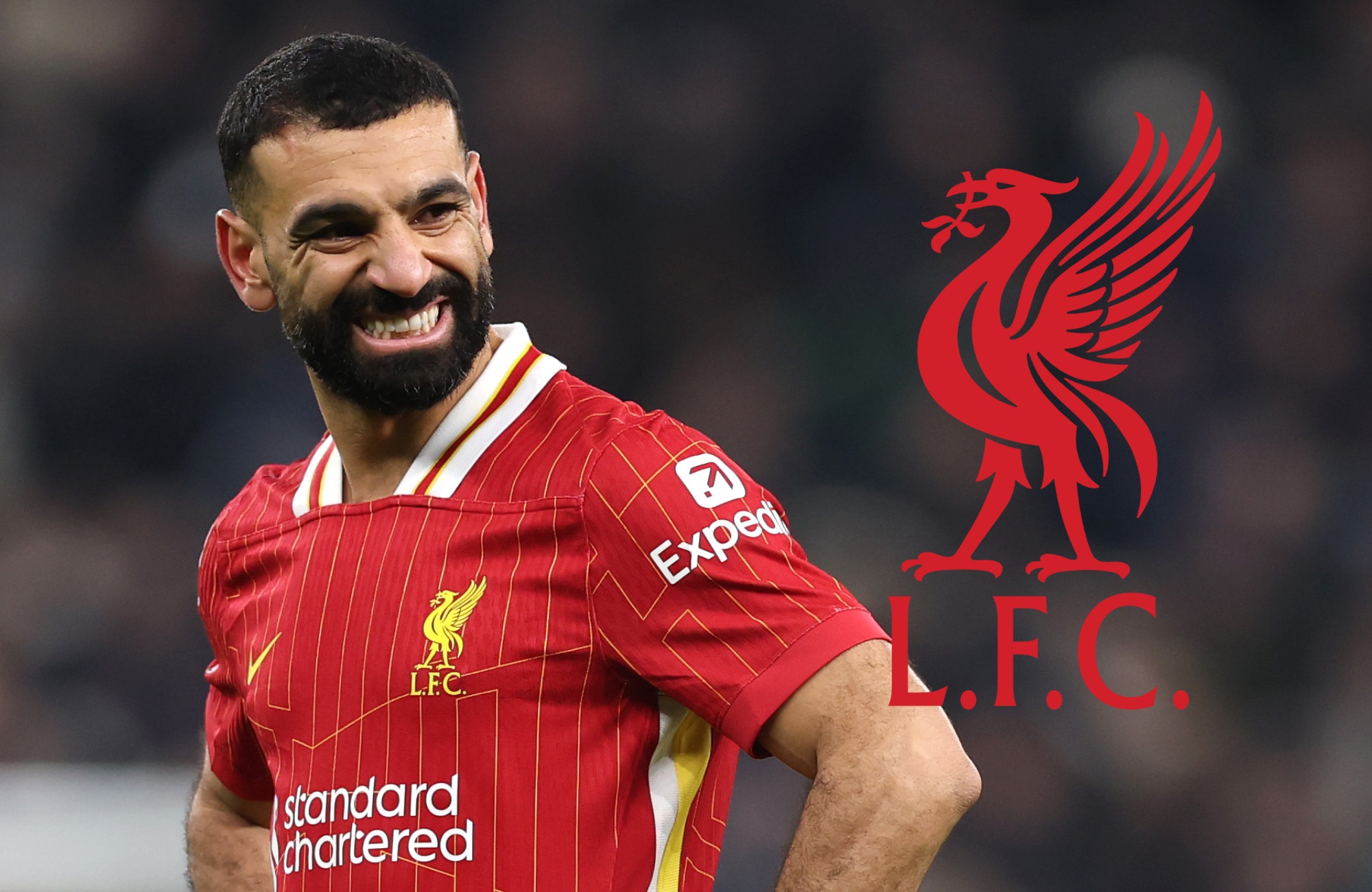 Mo Salah grimaces next to the Liverpool club crest.