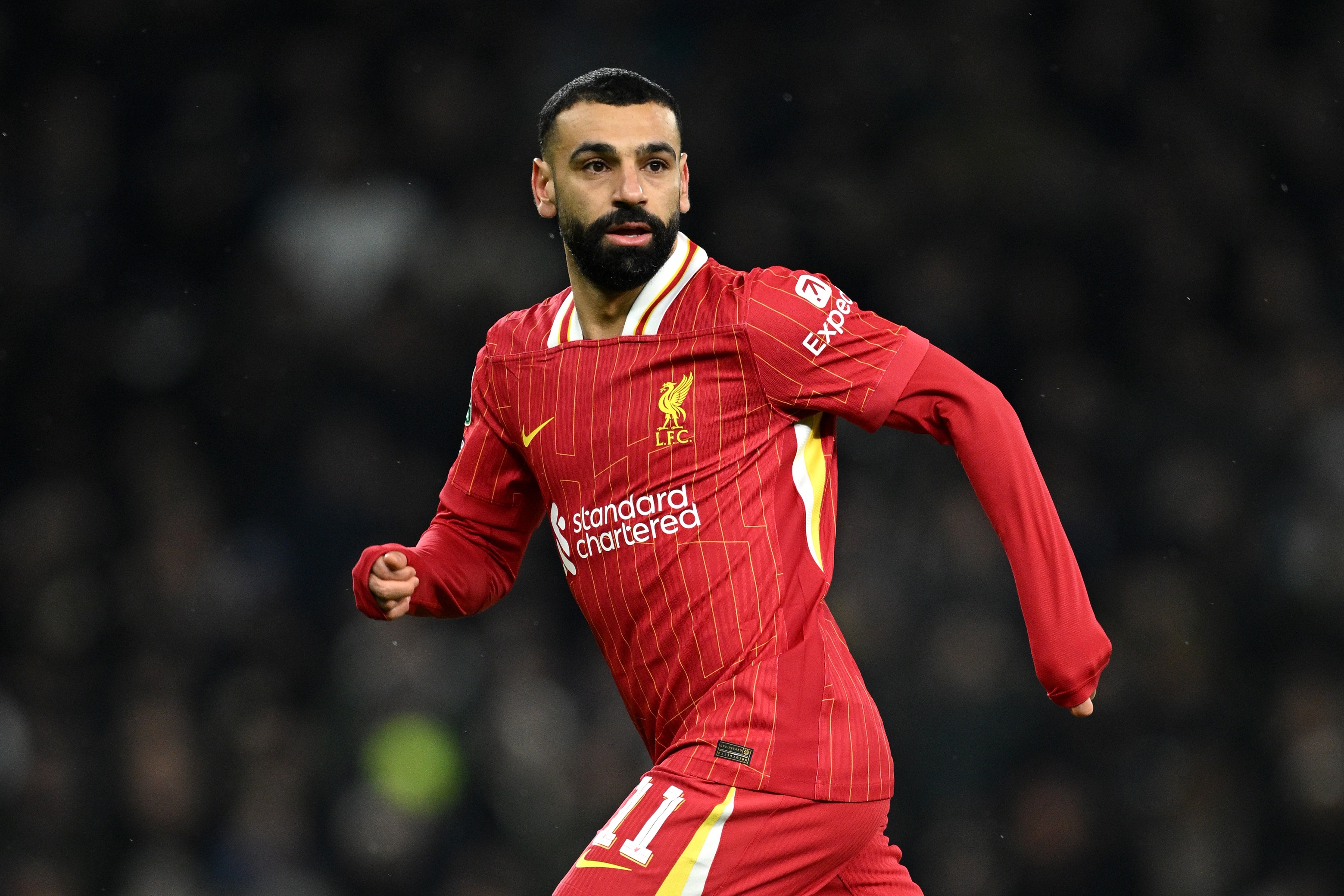 Mo Salah breaks into a run at the Tottenham Hotspur Stadium.